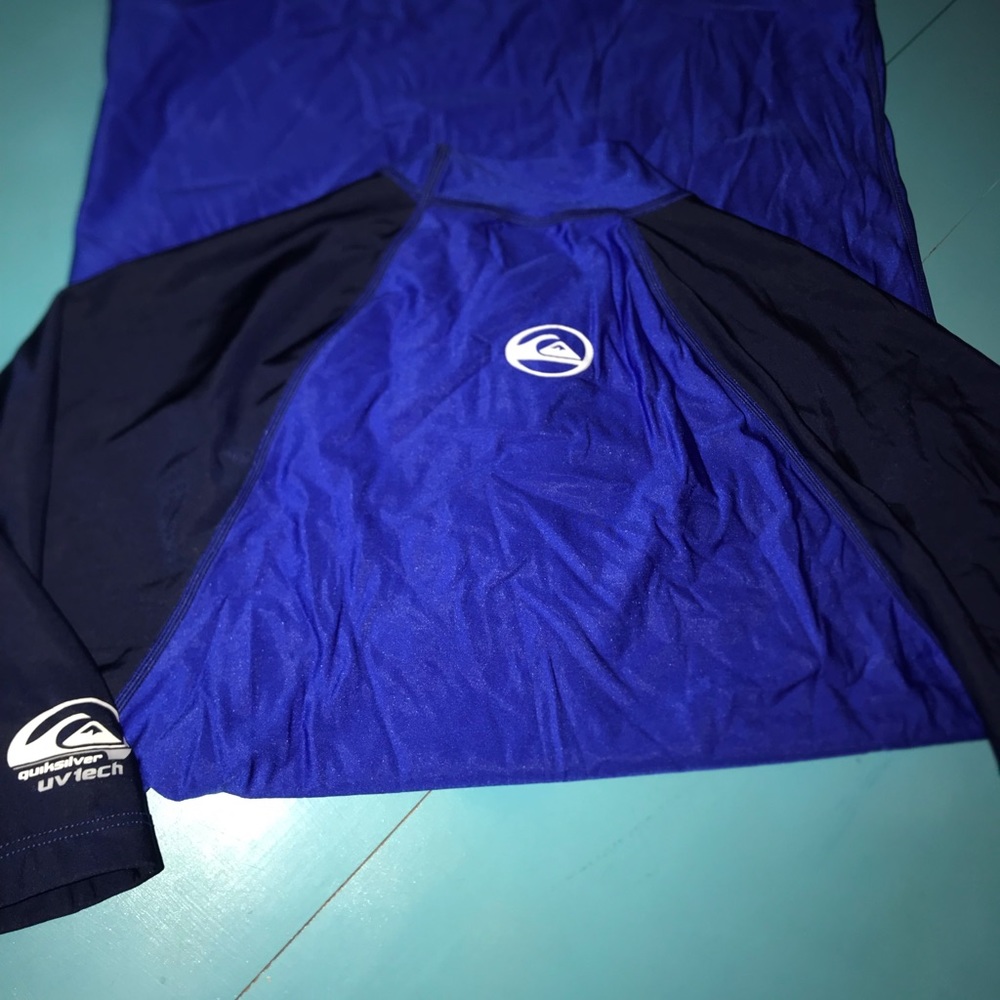 Quick Silver. Surf wear.  Blue short sleeves